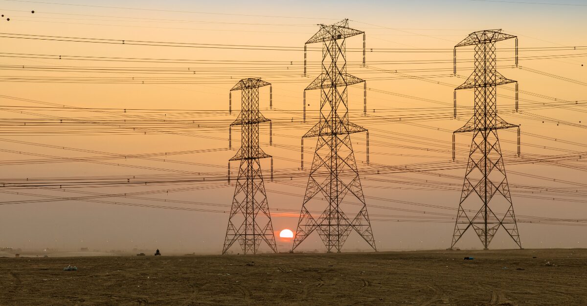 electricity towers at sunset